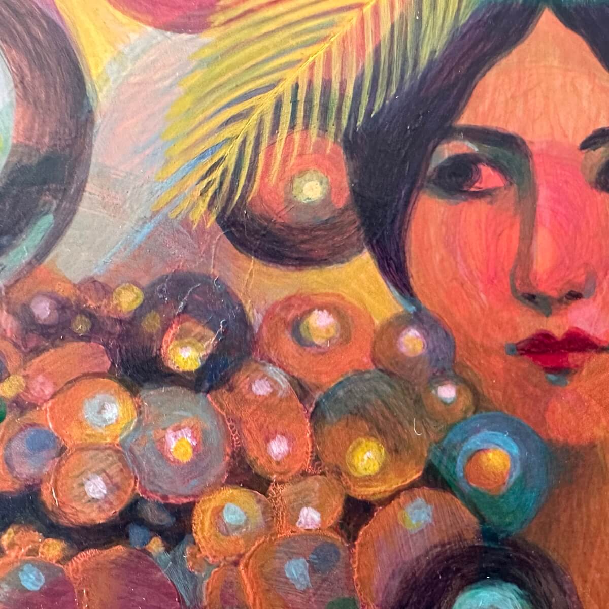 Colourful artwork detail of a face with feathers and circles