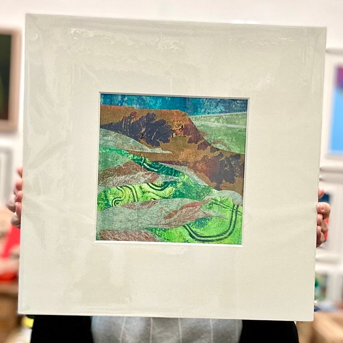Mounted Yorkshire landscape, held in front of a blurred indoor background.