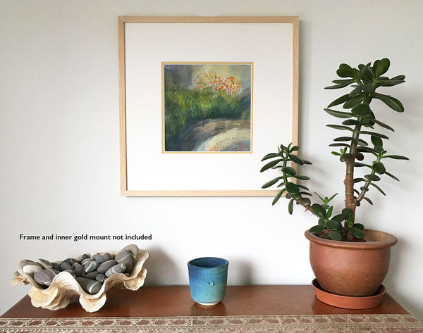 Quietude, square acrylic gouache landscape painting by Teresa Flavin, golden green grasses, orange flower forms and grey green water, shown in white mount and wood frame on wall.